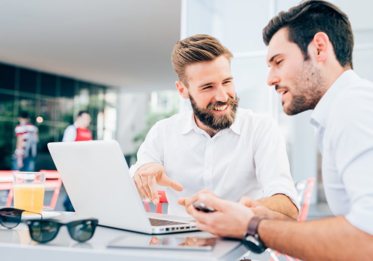 two men using business internet services to collaborate and get work done